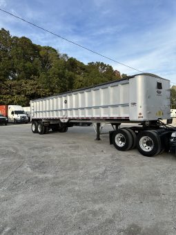 2017 Freightliner Cascadia 125 with 2003 Mack End Dump Trailer full