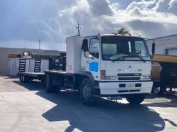 2007 Mitsubishi FM 330 with, 2022 Hooper Equipment Trailer, 22.5 Ton, Gooseneck and 2006 PJ Dump Hurricane Clean Up Trailer, 10 Ton, Gooseneck. full