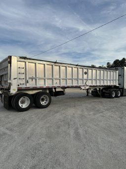 2017 Freightliner Cascadia 125 with 2003 Mack End Dump Trailer full