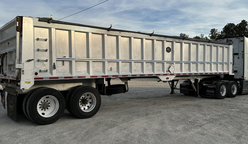 2017 Freightliner Cascadia 125 with 2003 Mack End Dump Trailer full