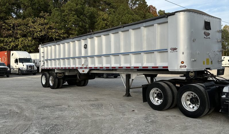 2017 Freightliner Cascadia 125 with 2003 Mack End Dump Trailer full
