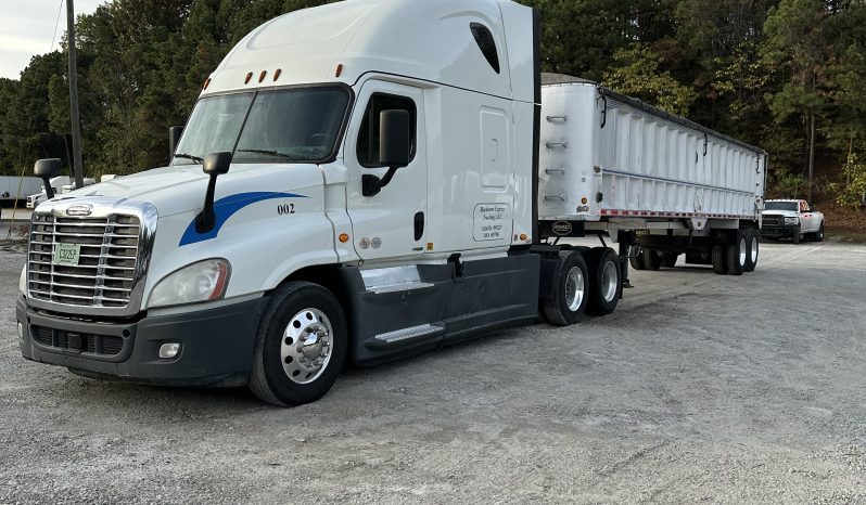 2017 Freightliner Cascadia 125 with 2003 Mack End Dump Trailer full